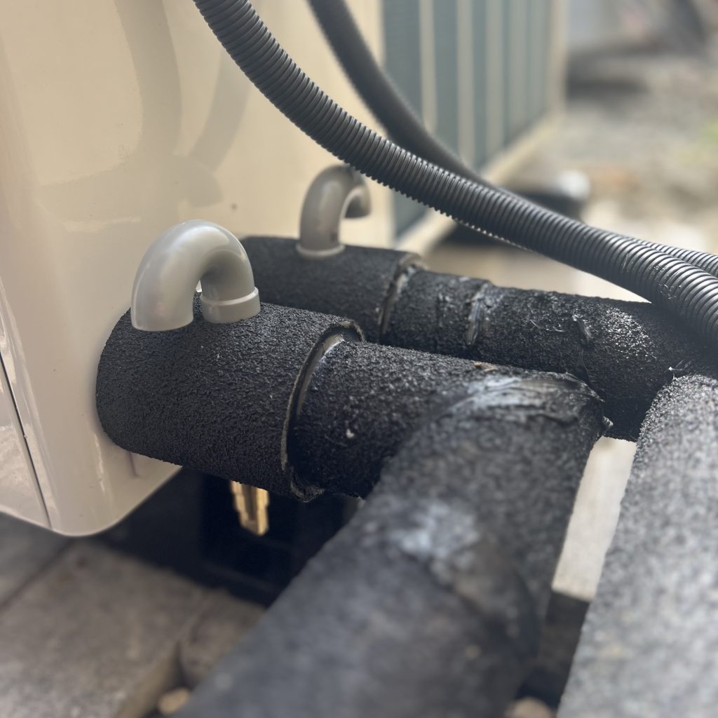 Close-up of insulated pipework for an air source heat pump installation in Scotland by Aventus Eco