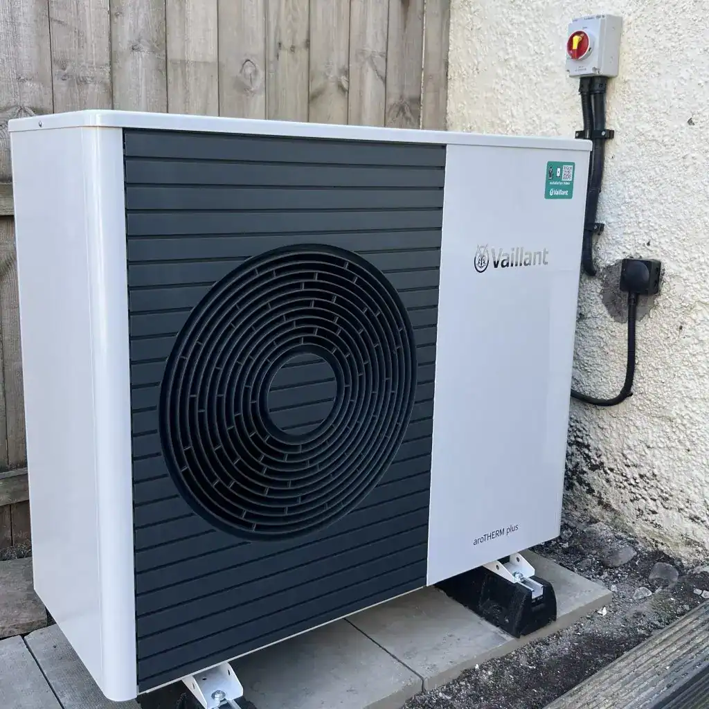 Vaillant aroTHERM plus air source heat pump installation beside a wooden fence in Scotland by Aventus Eco