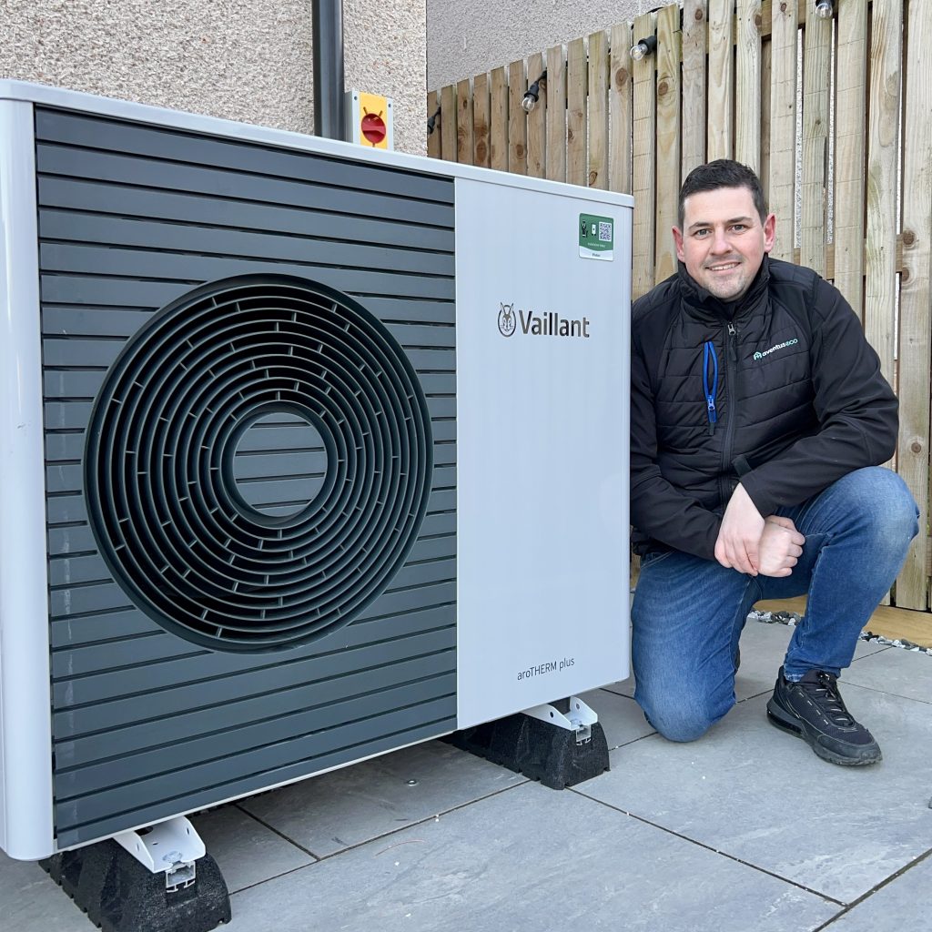 Aventus Eco engineer beside a newly installed Vaillant aroTHERM plus air source heat pump in Scotland
